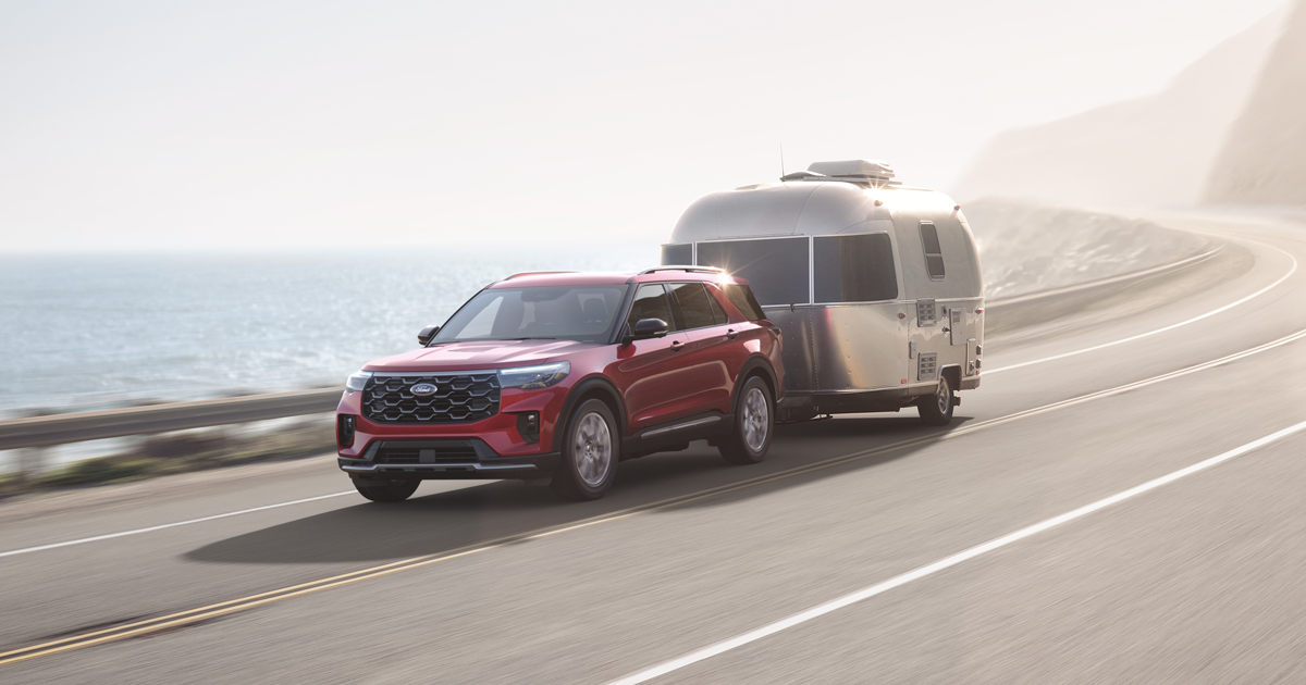 A Ford Explorer towing a trailer behind it.